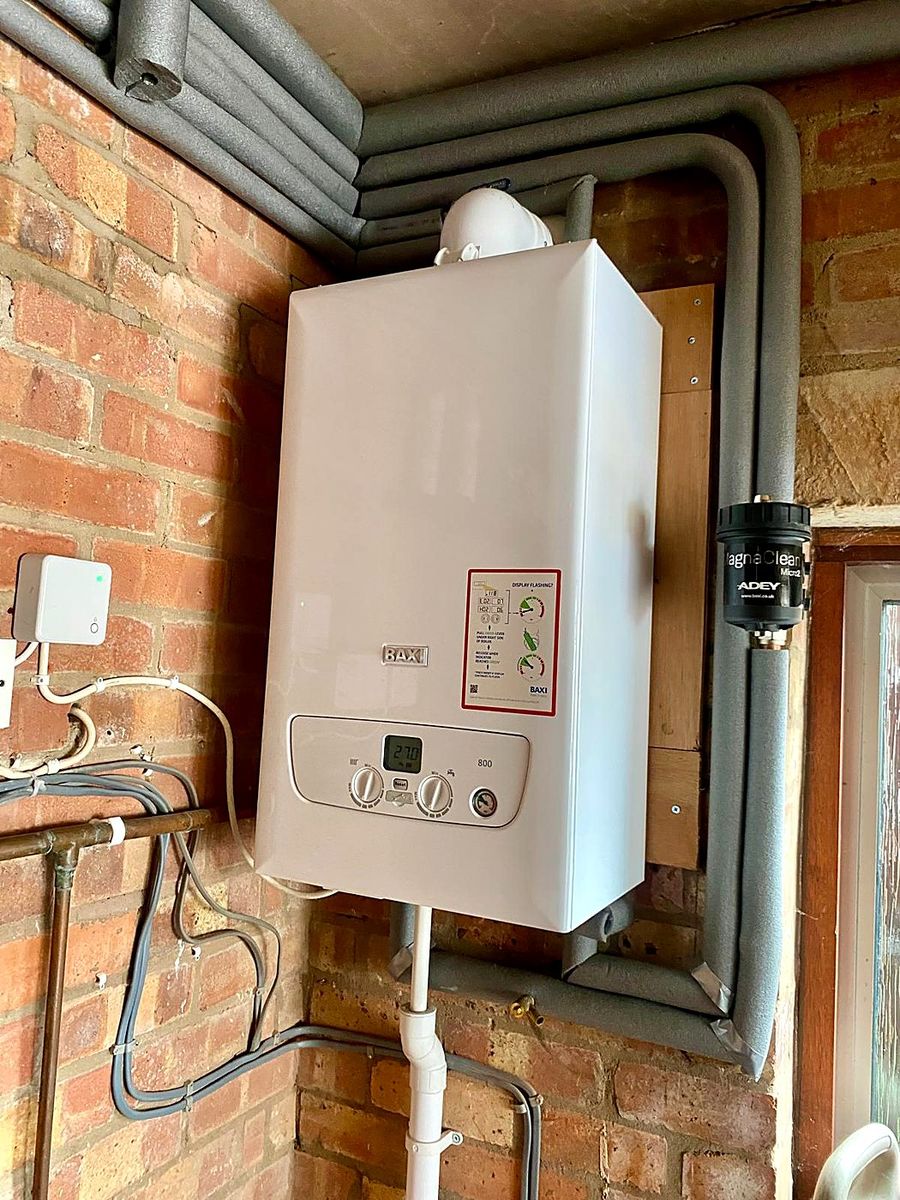 Baxi boiler and MagnaClean filter on an exposed brick wall
