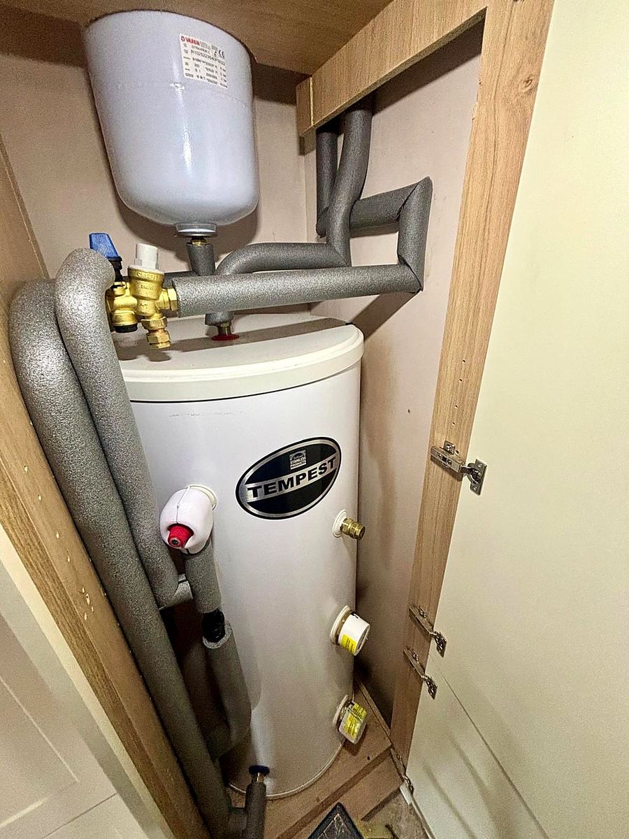 Tempest unvented cylinder neatly installed in an airing cupboard