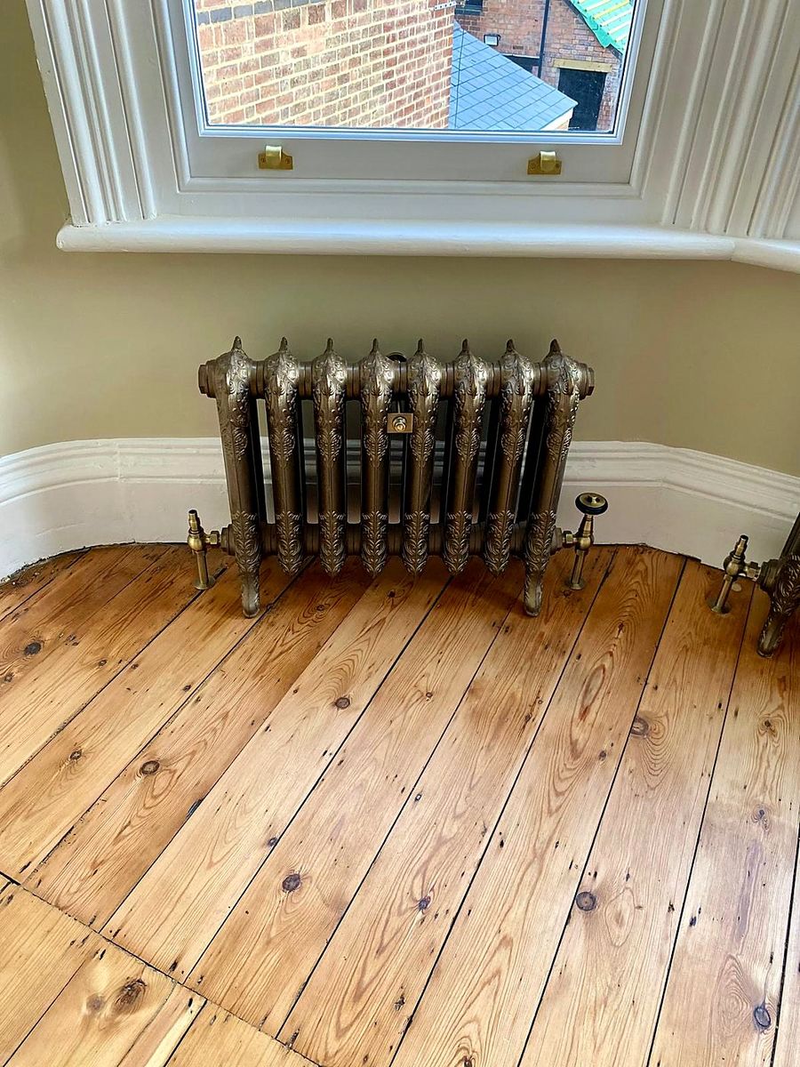 Restored cast-iron radiator in a period home