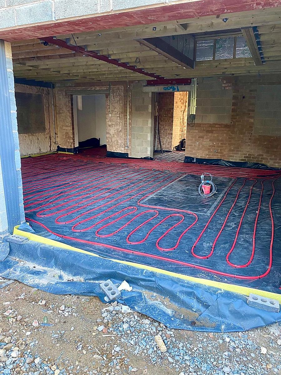 Underfloor heating pipework laid across a room